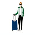 The guy in black trousers, sneakers and a green jacket with a suitcase is traveling. Royalty Free Stock Photo